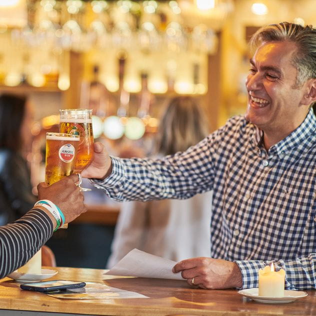 Photo of colleagues in the pub cheersing