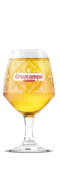 Pint of Cruzcampo in a branded glass with a white background.